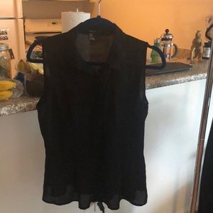 Black button-down sleeveless tank top with collar